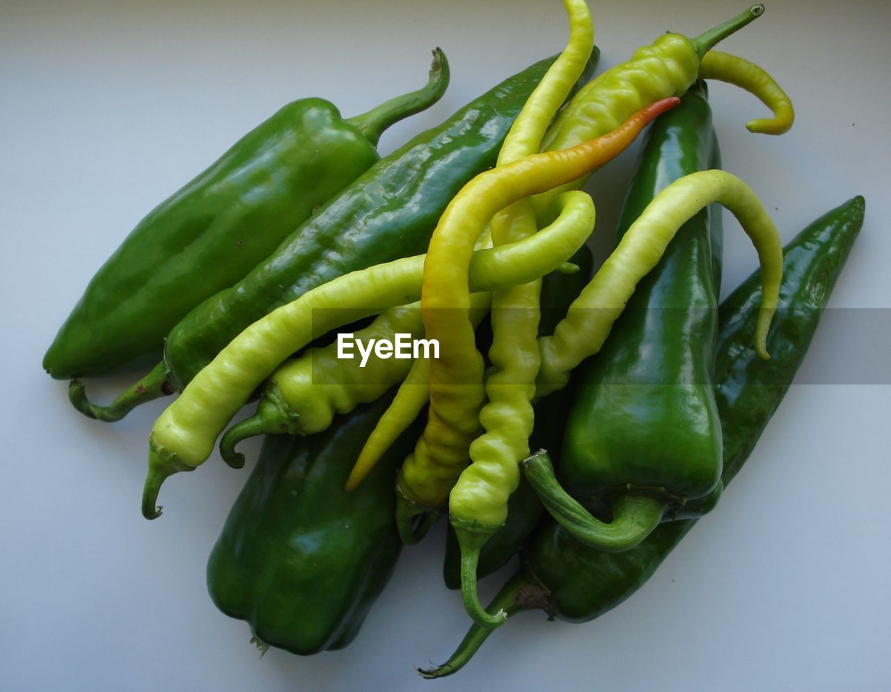 High angle view of green chili peppers