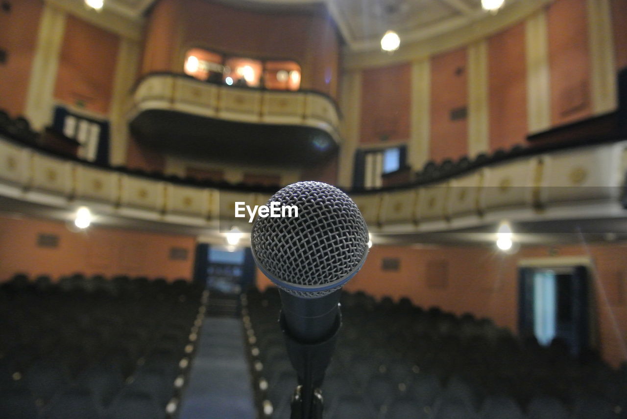 Close-up of microphone in theater