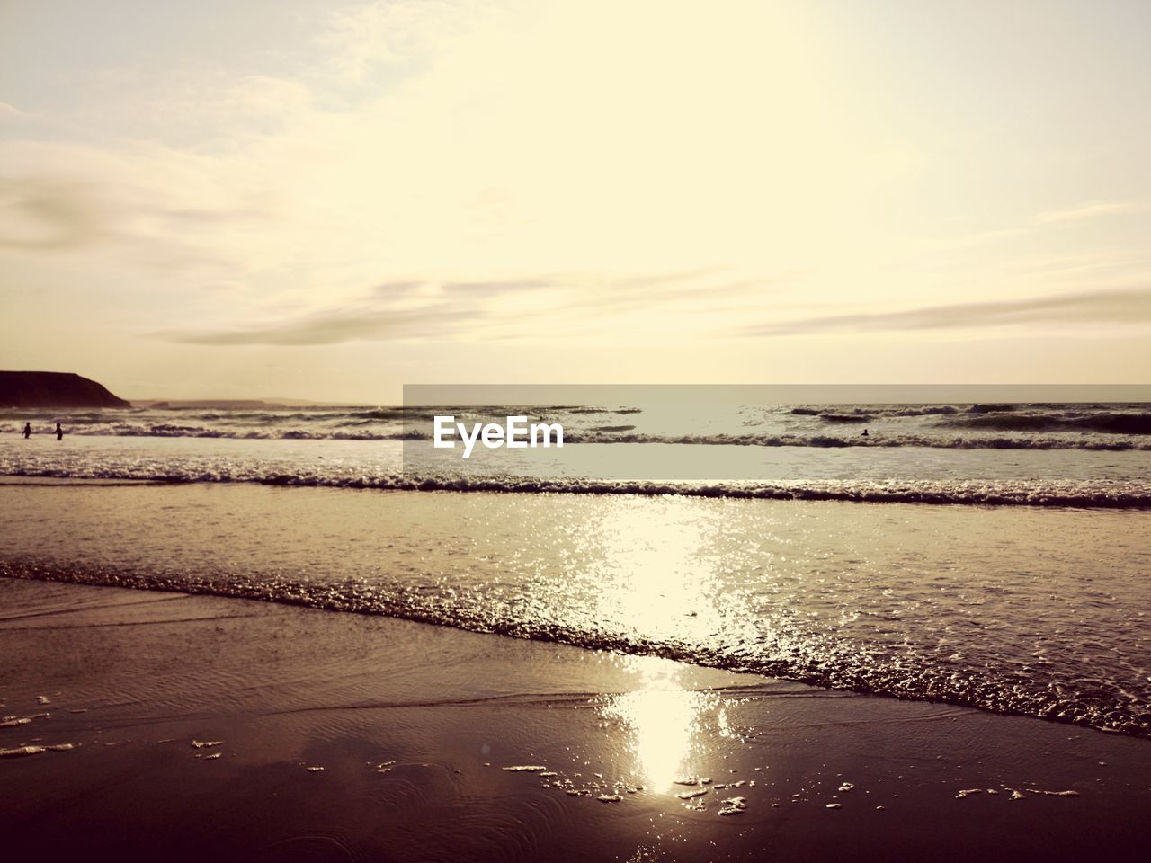 SCENIC VIEW OF BEACH DURING SUNSET