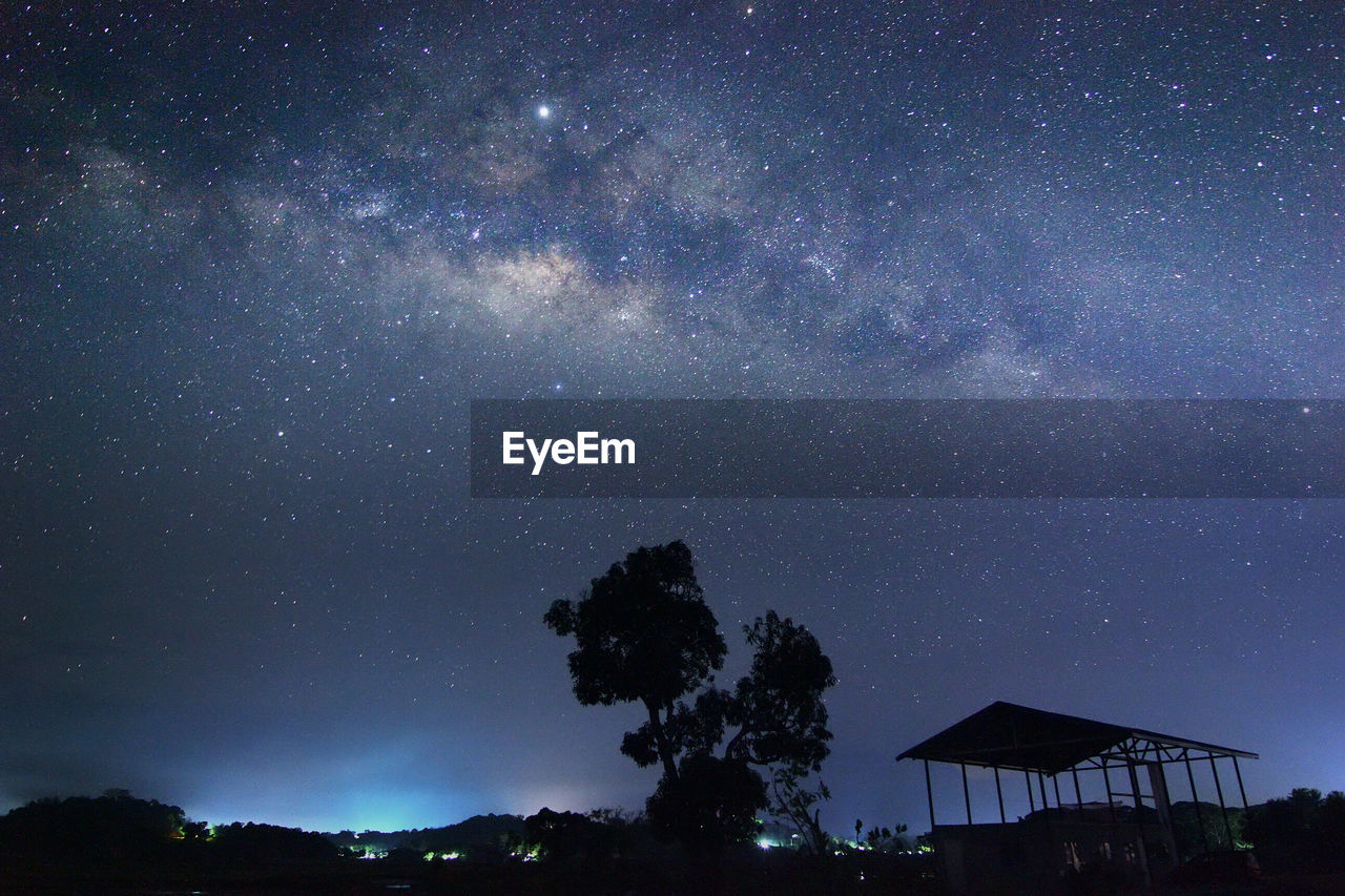 LOW ANGLE VIEW OF STAR FIELD AGAINST SKY