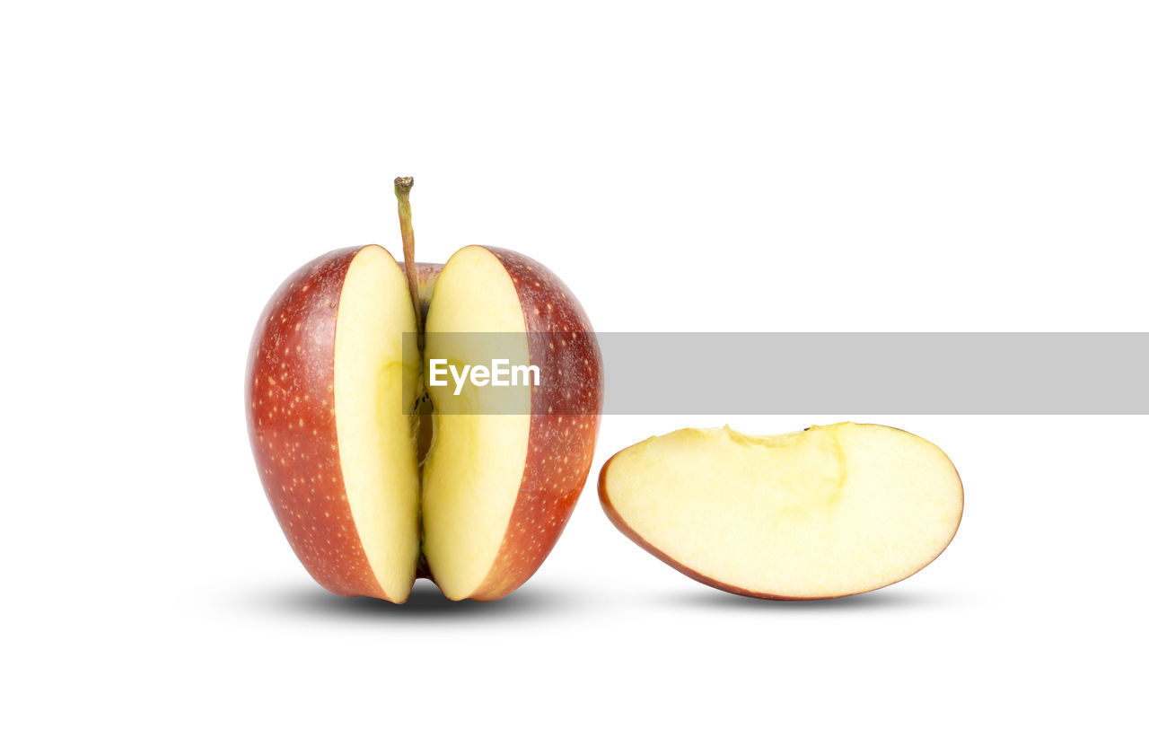 Red apple cut and sliced a piece on white background, isolated and clipping path