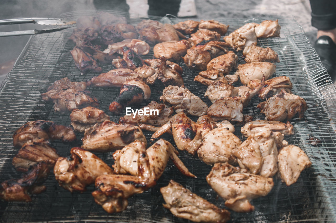 High angle view of meat on barbecue grill