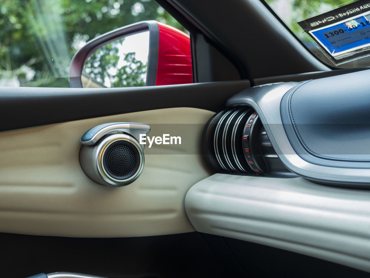 low section of man photographing in car