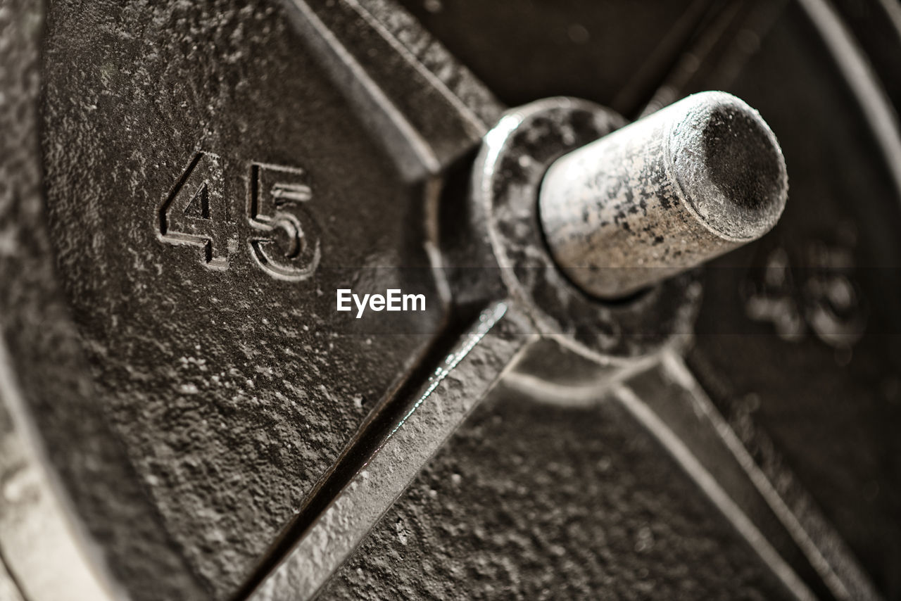 CLOSE-UP OF TEXT ON METAL CONTAINER