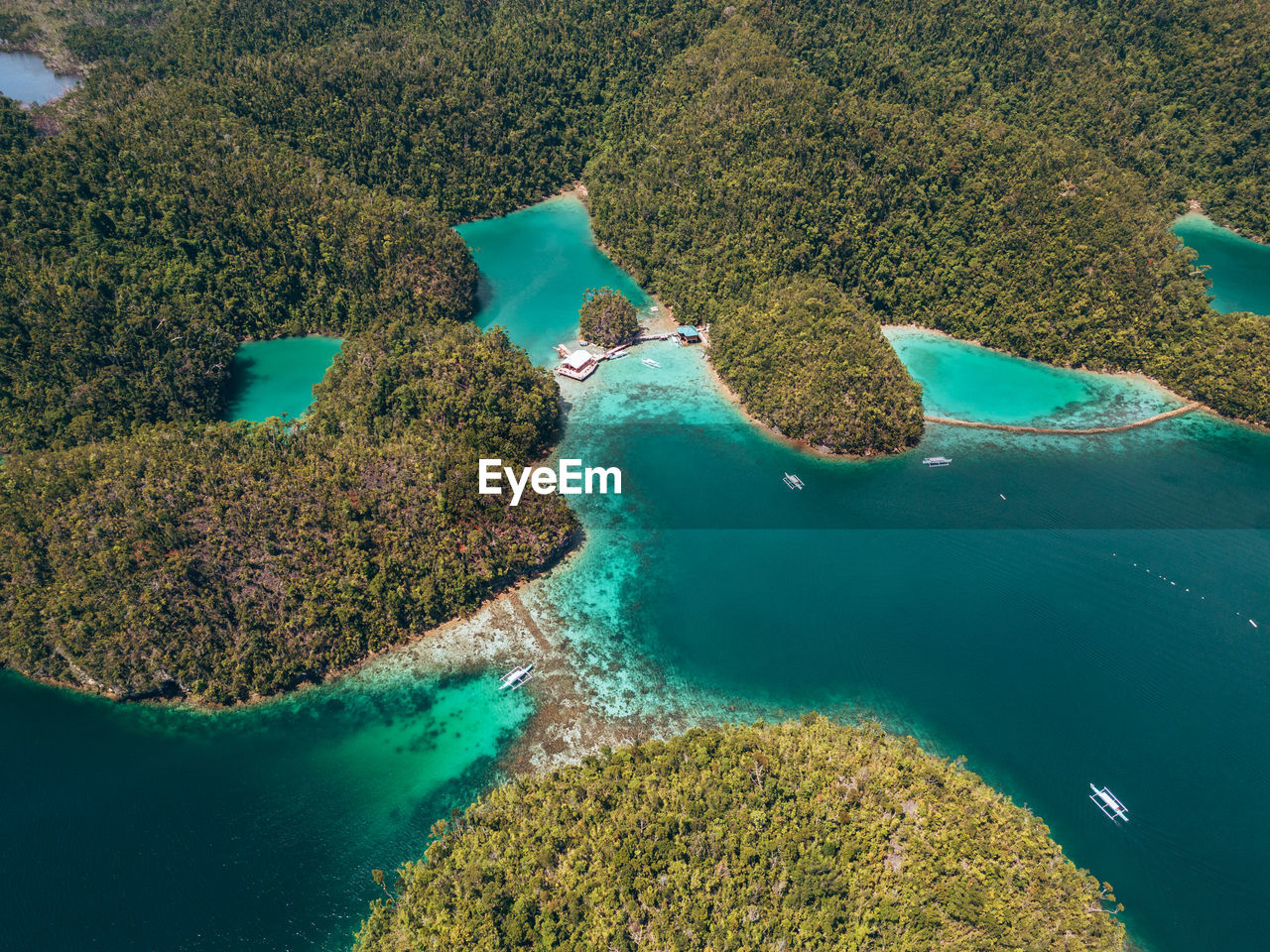 water, aerial photography, aerial view, land, sea, archipelago, nature, scenics - nature, beauty in nature, beach, environment, coast, no people, tranquility, island, landscape, high angle view, lagoon, coastline, outdoors, turquoise colored, day, plant, travel destinations, tranquil scene, travel, green, coral, reef, bay, islet, tree, idyllic, tourism, blue, coral reef, ocean, tropical climate, non-urban scene