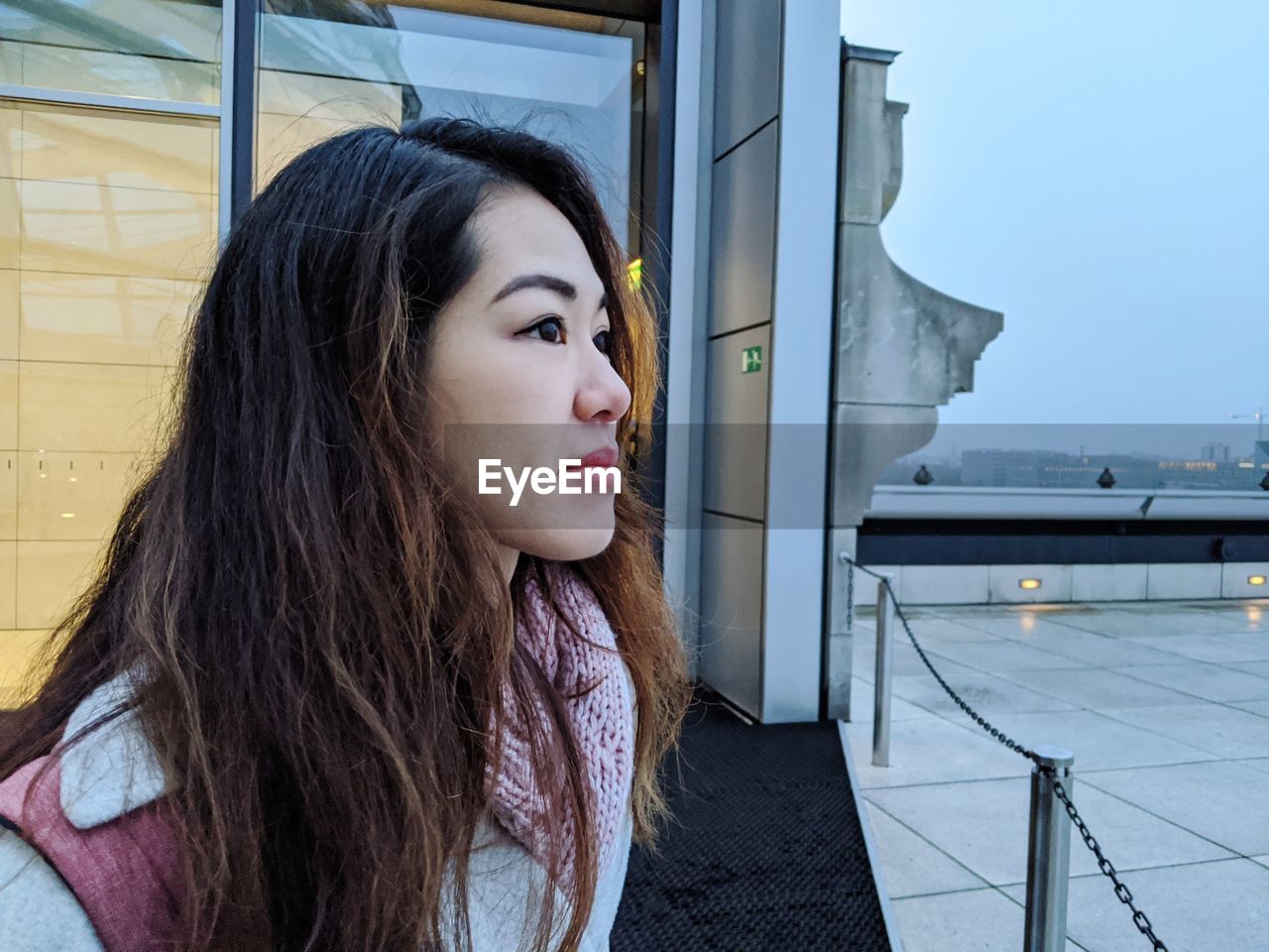 Portrait of beautiful young woman looking away