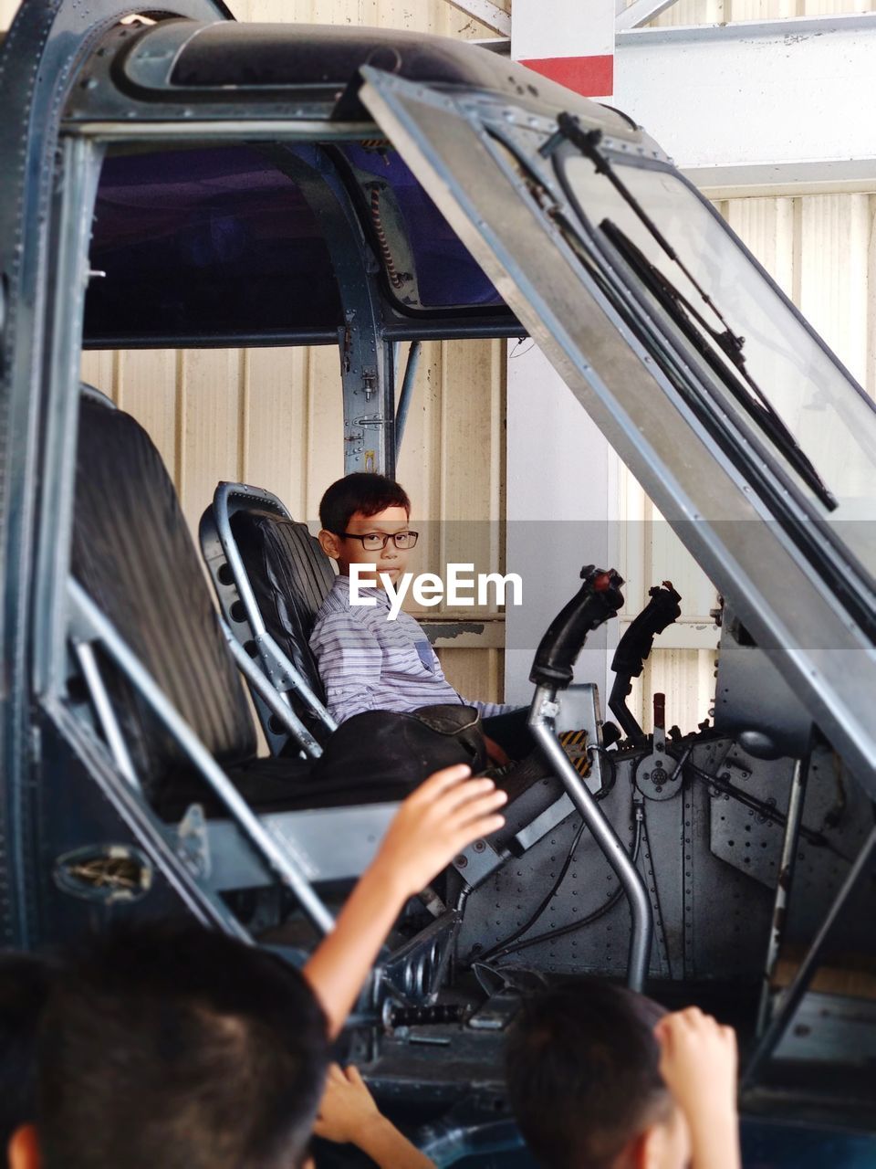 FULL LENGTH PORTRAIT OF YOUNG MAN TRAVELING IN BUS