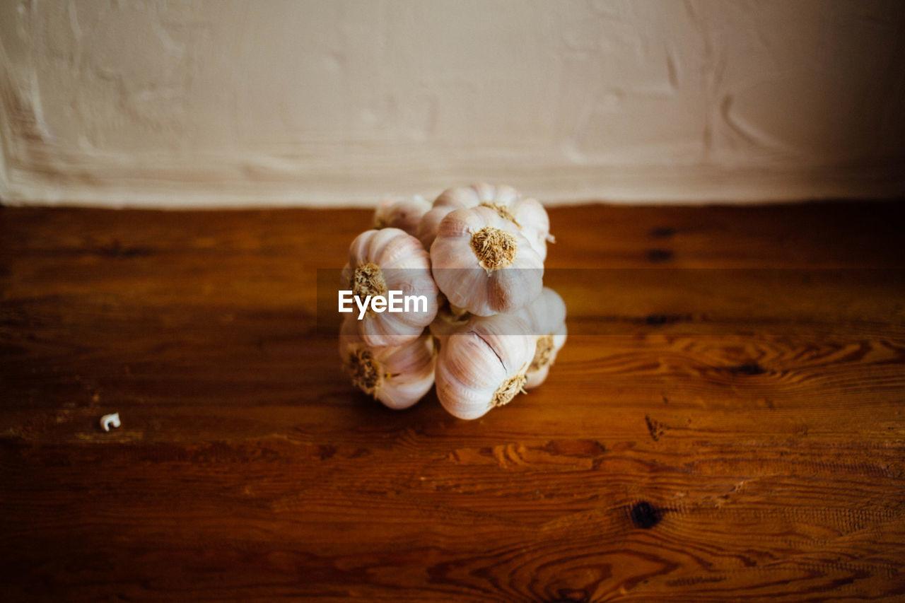 Close-up of garlic bulbs on table