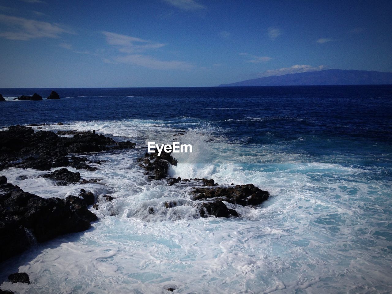 Waves crashing against rocks