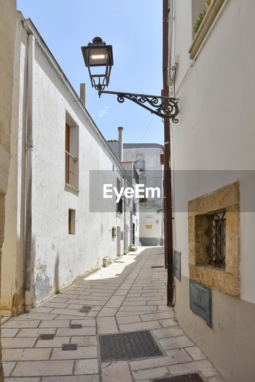 A narrow street among the old houses of irsina in basilicata, region in southern italy.