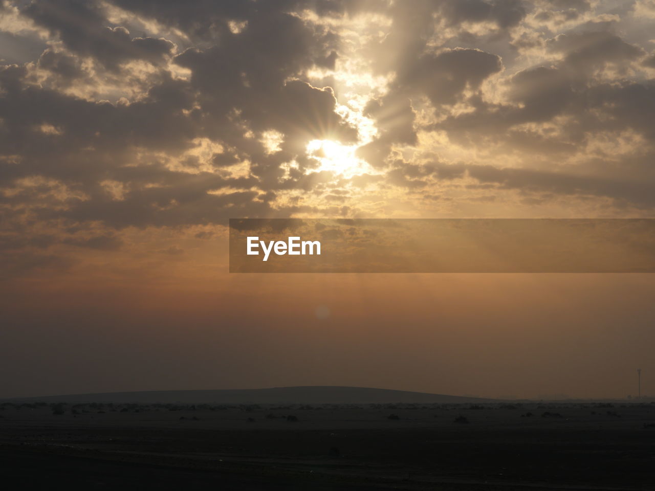 SCENIC VIEW OF SUNSET OVER LANDSCAPE