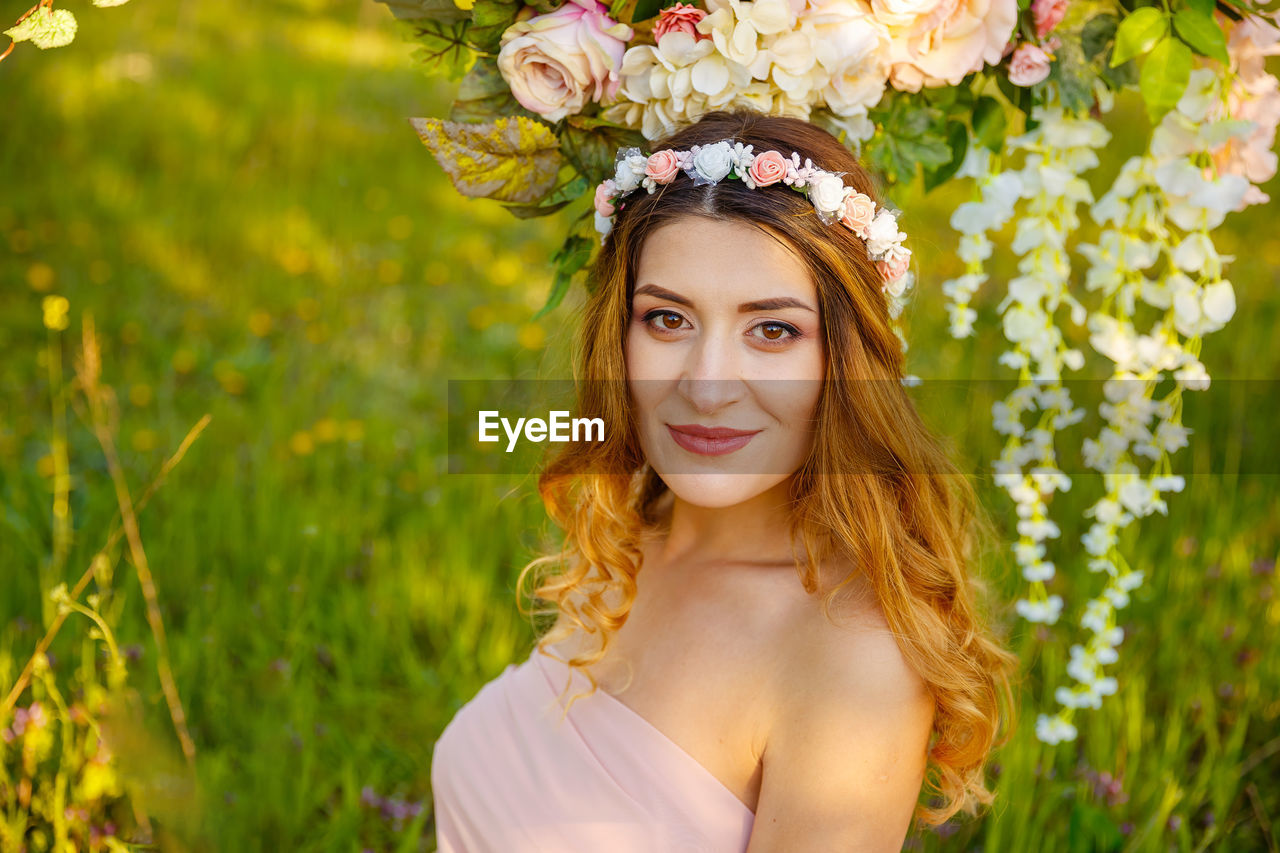 Portrait of beautiful young woman wearing flowers