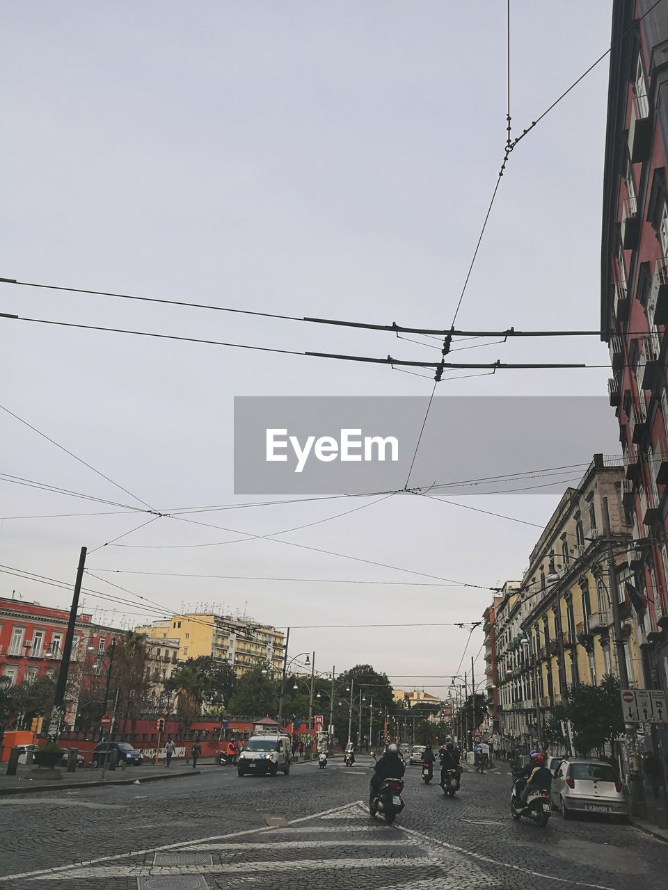 CARS ON ROAD AGAINST SKY