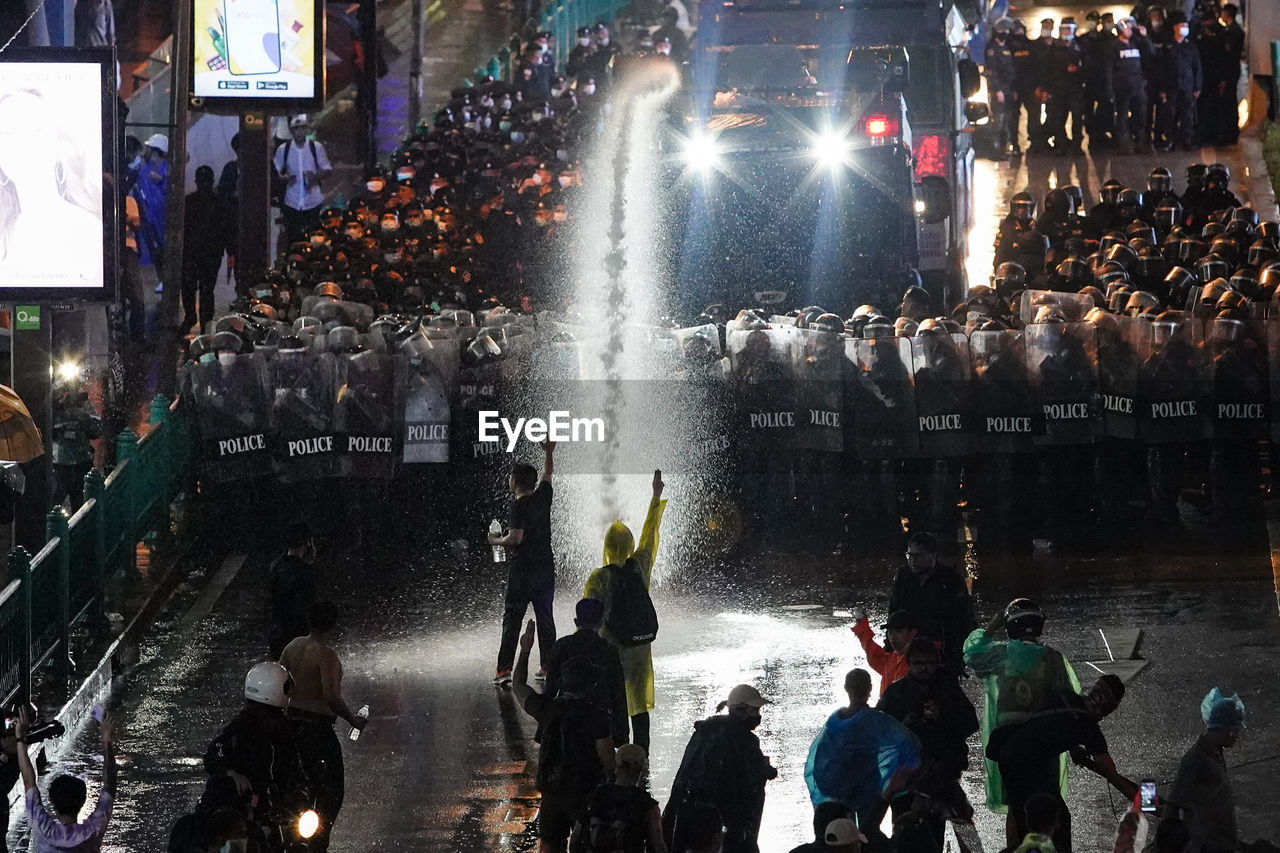 Thai police shot a tear gas mixed in water aganist peaceful anti-goverment protesters in bangkok, th