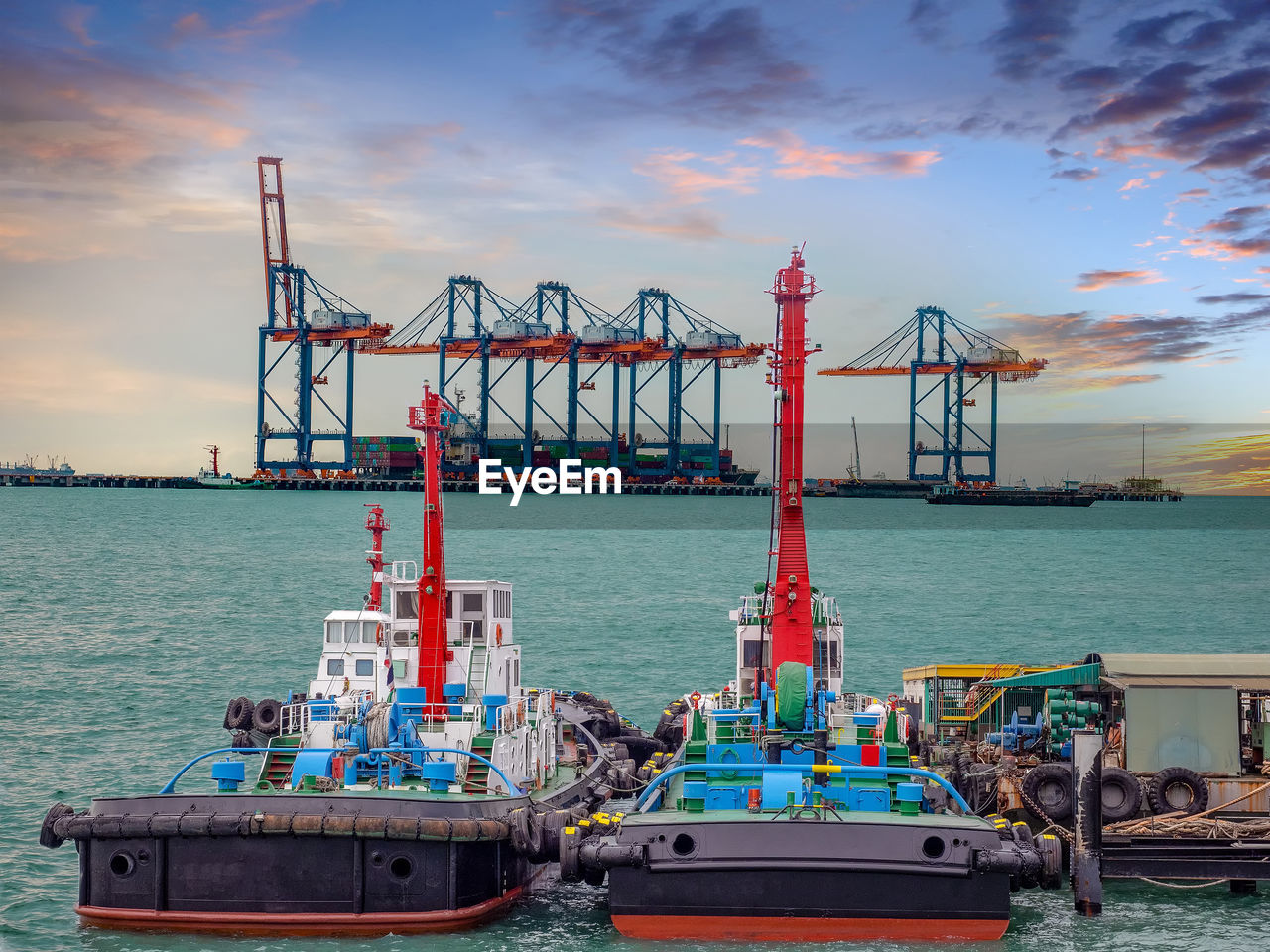 Tugboats alongside at jettyt for awaiting and assist the vessel to berth.