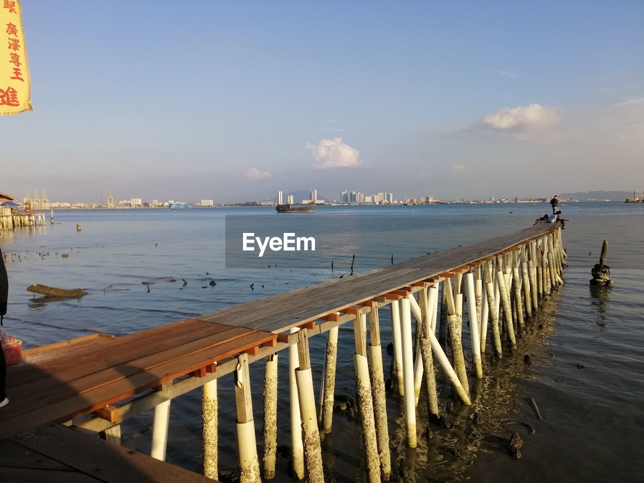 SCENIC VIEW OF SEA AND PIER AGAINST SKY