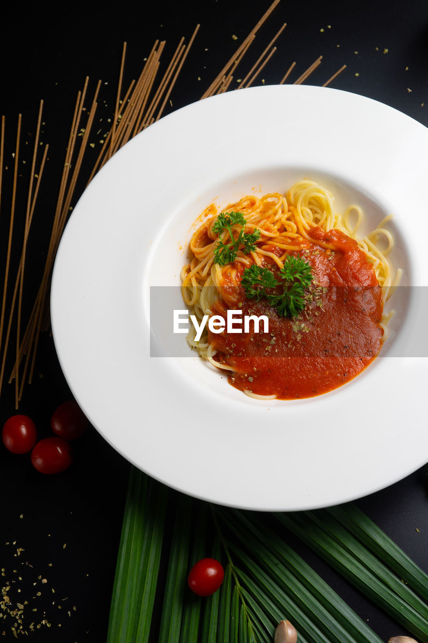 High angle view of pasta in plate on table