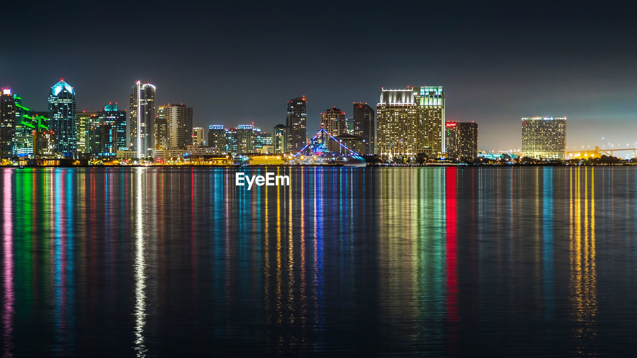 Illuminated buildings in city at night