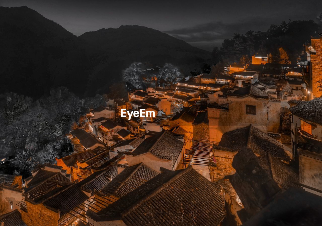 High angle view of illuminated buildings at night