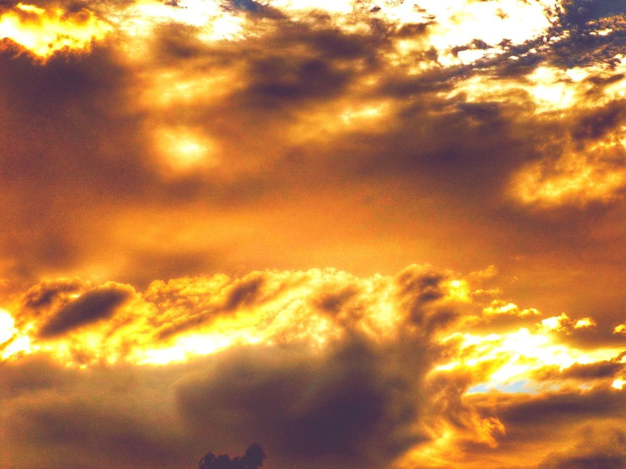 Low angle view of orange cloudy sky at sunset