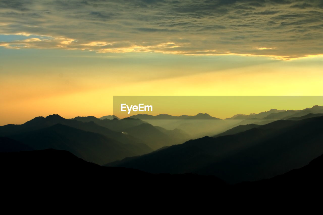 Scenic view of mountains at sunset