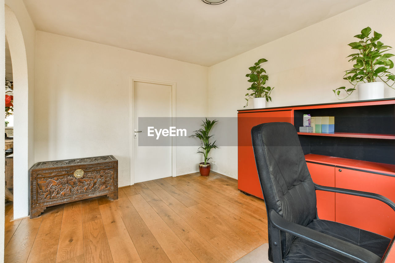 empty chairs and table in room