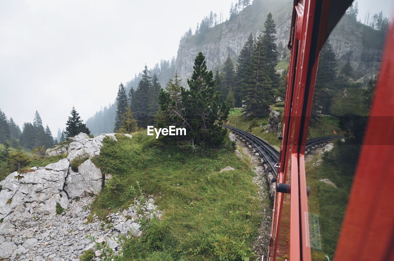 Personal perspective of train passing through scenic landscape