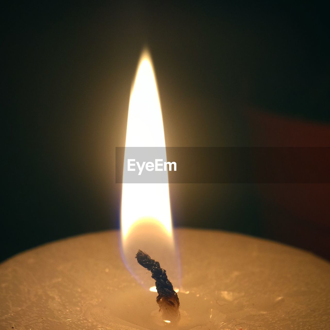 Close-up of burning candle