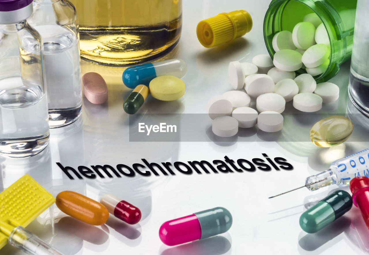 Digital composite image of hemochromatosis text amidst medicine on table