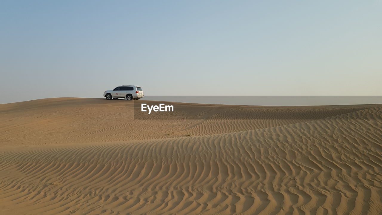 SCENIC VIEW OF DESERT AGAINST SKY