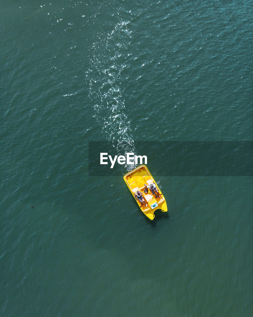 High angle view of people boating on sea