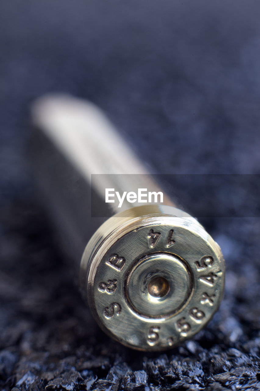 Close-up of bullet on table