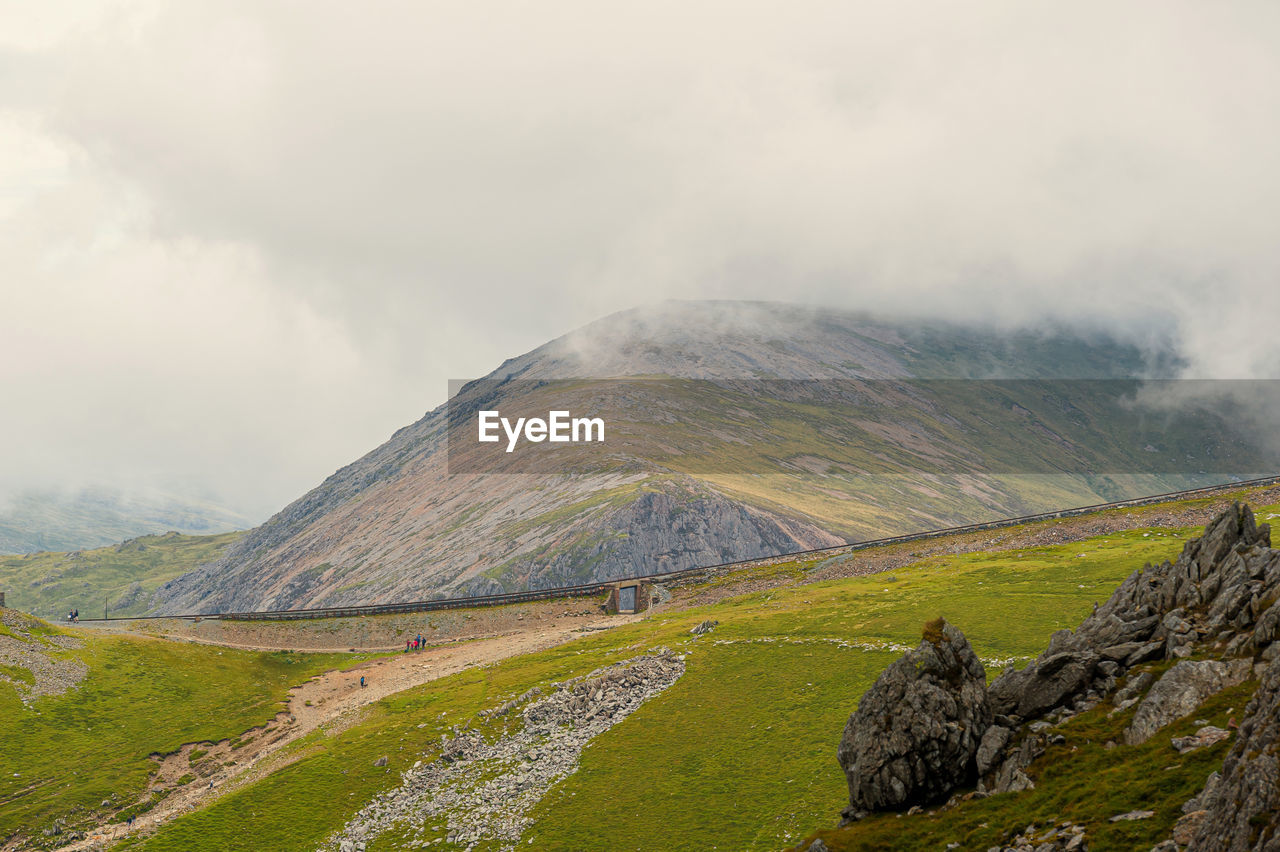 View from ranger path at llanberis path and mountain train to yr wyddfa peak - snowdon in wales. uk