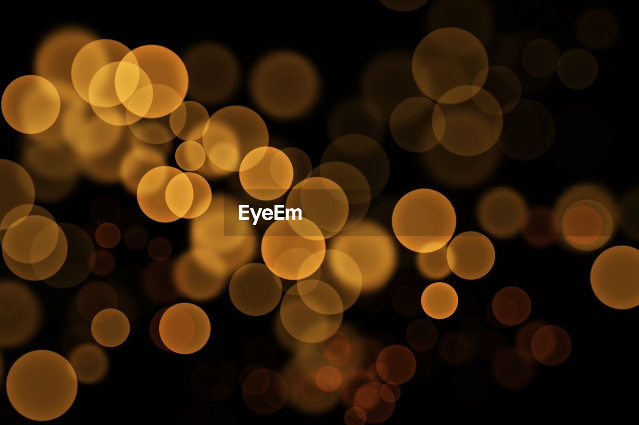 Defocused image of illuminated lights at night