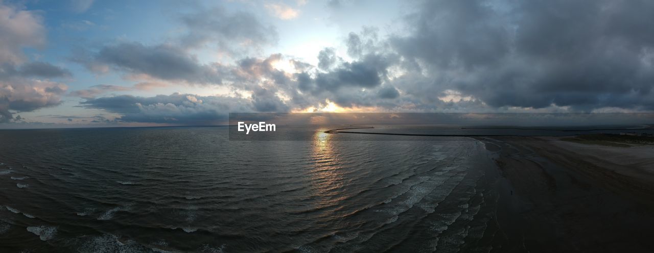 PANORAMIC SHOT OF SEA AGAINST SUNSET SKY