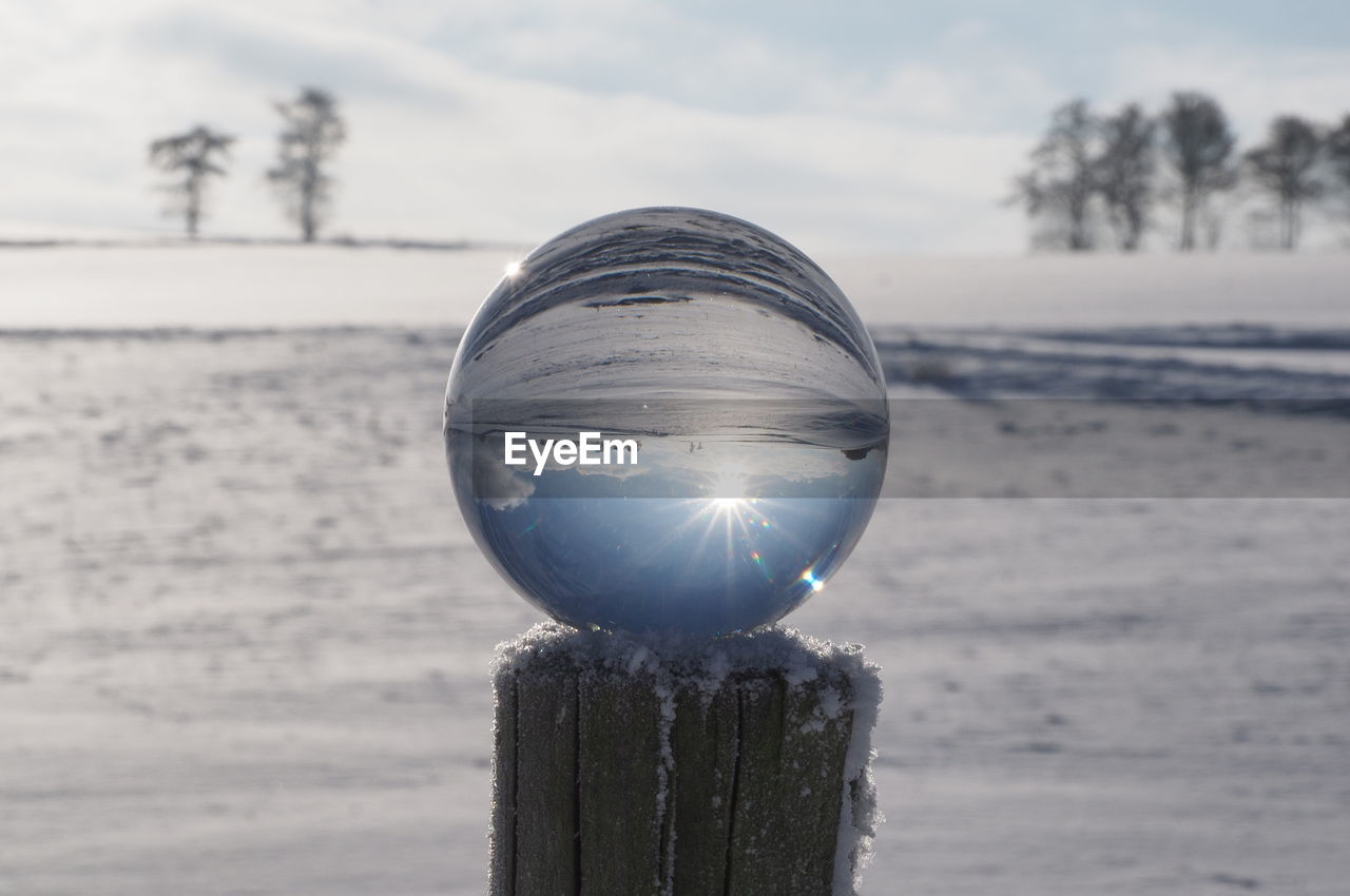 CLOSE-UP OF ICE AGAINST SKY