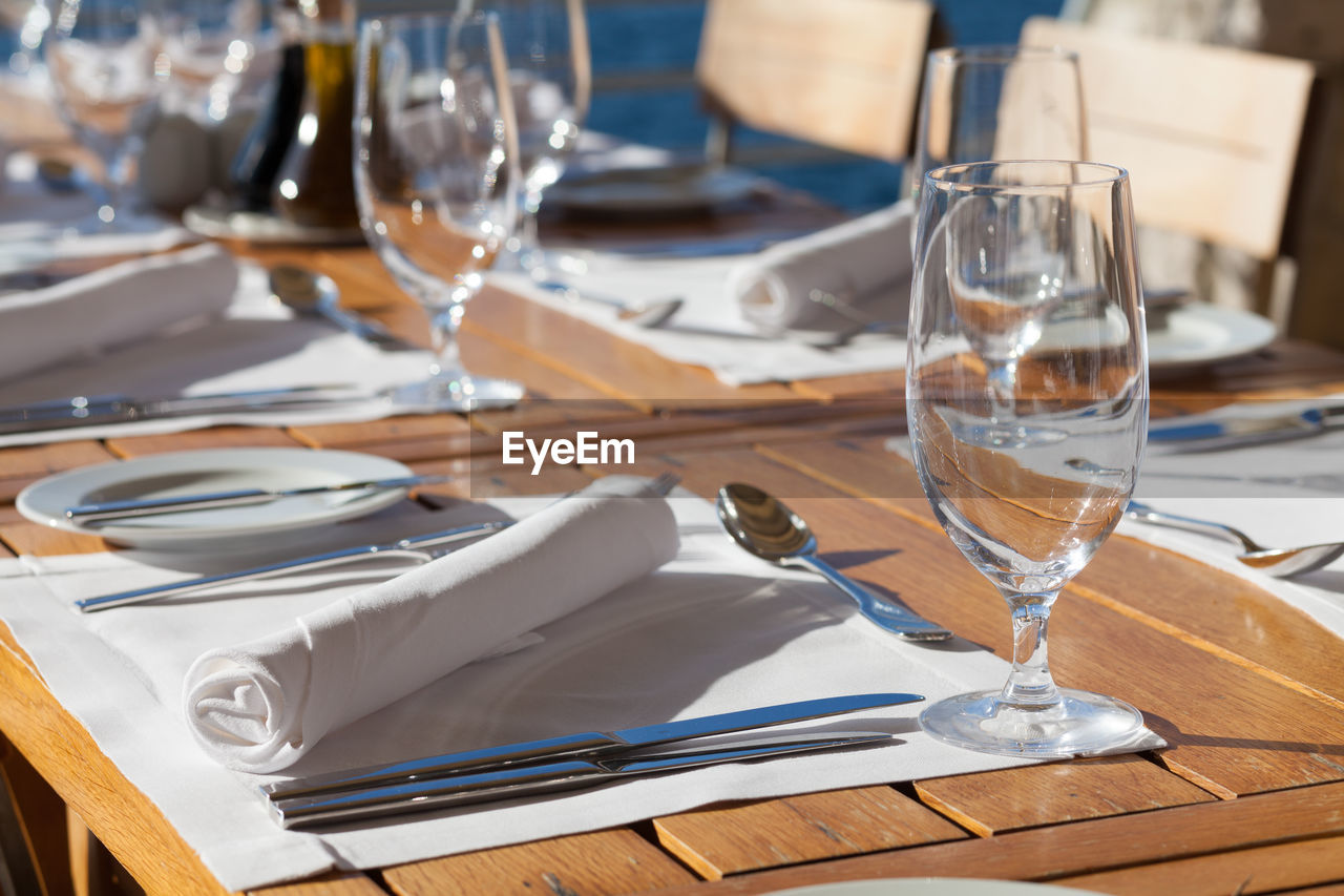 Close-up of wine glasses on table