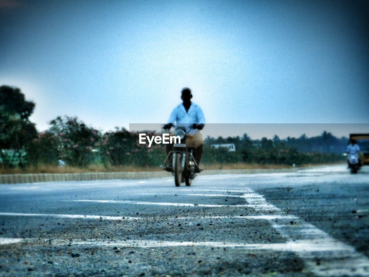 WOMAN WALKING ON ROAD