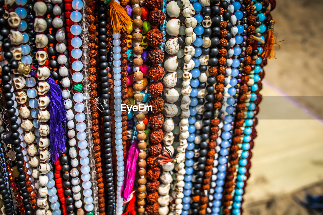 Close-up of multi colored jewelry for sale