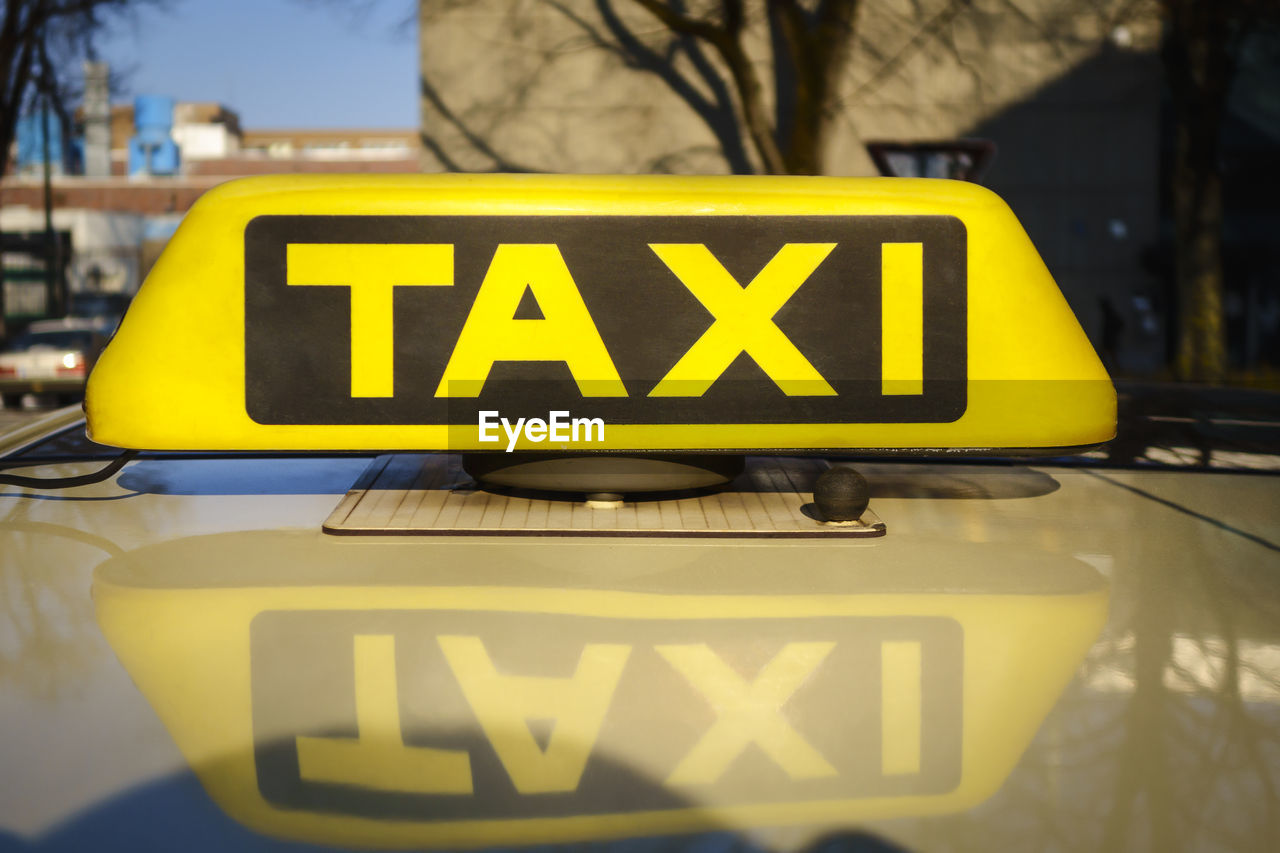 Close-up of taxi sign