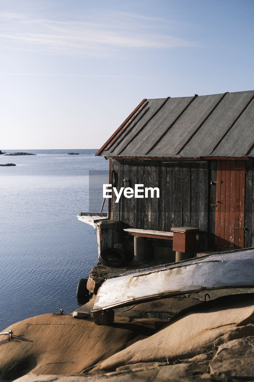 BUILT STRUCTURE ON SEA AGAINST SKY