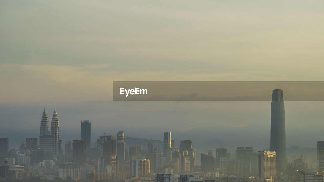 Morning mist with a view of kuala lumpur city.