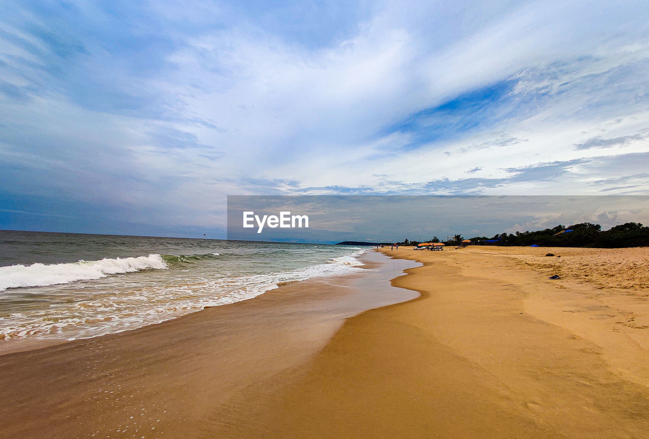 PANORAMIC VIEW OF BEACH AGAINST SKY