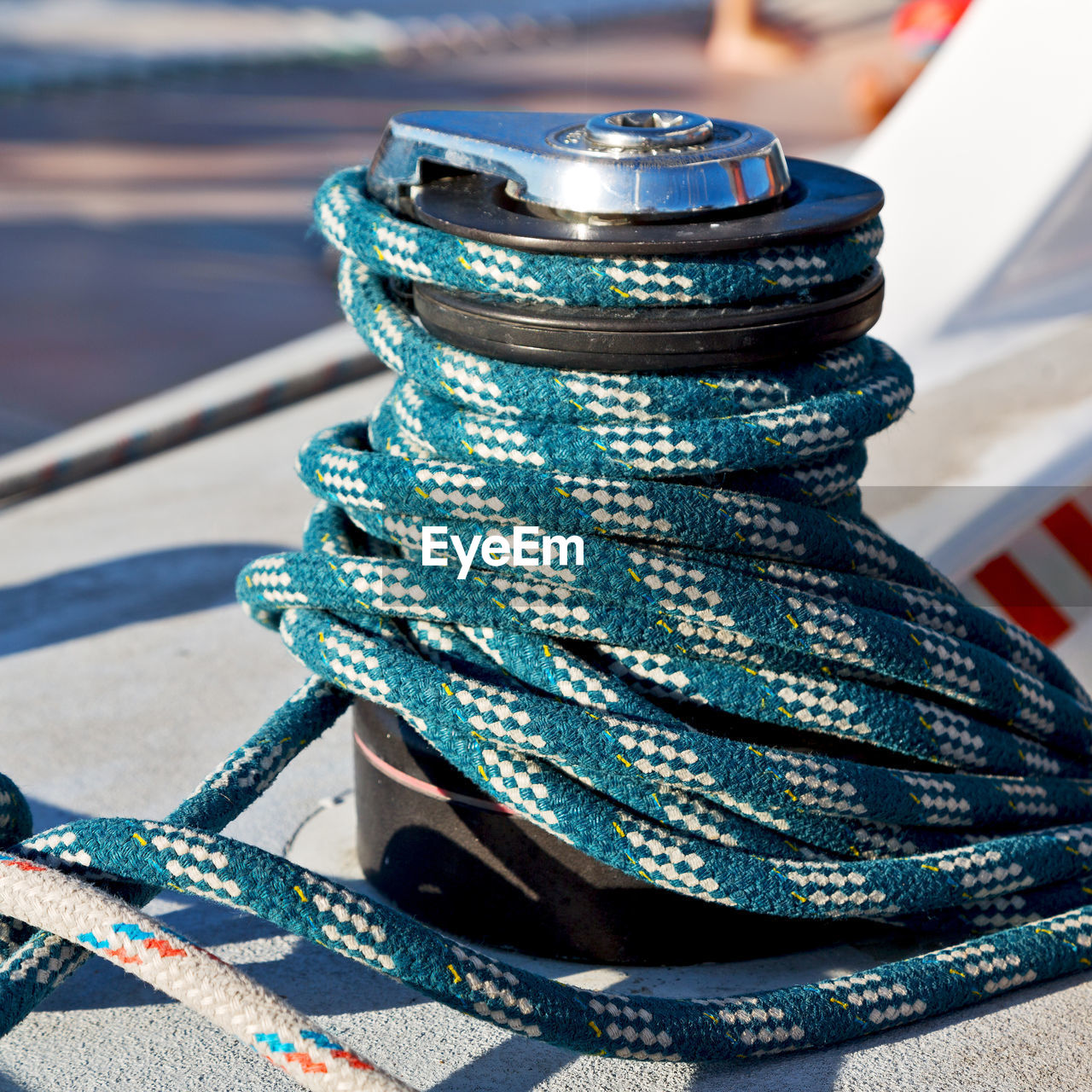 CLOSE-UP OF ROPES AGAINST BLUE SKY