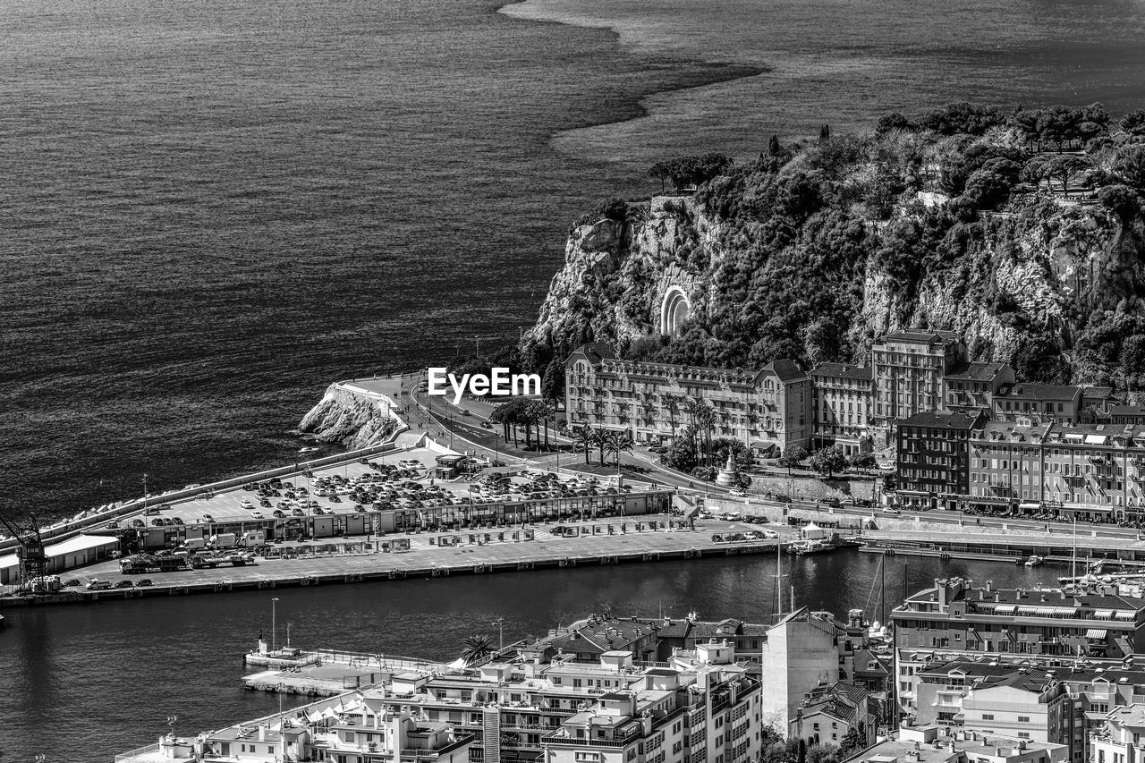 High angle view of townscape by sea