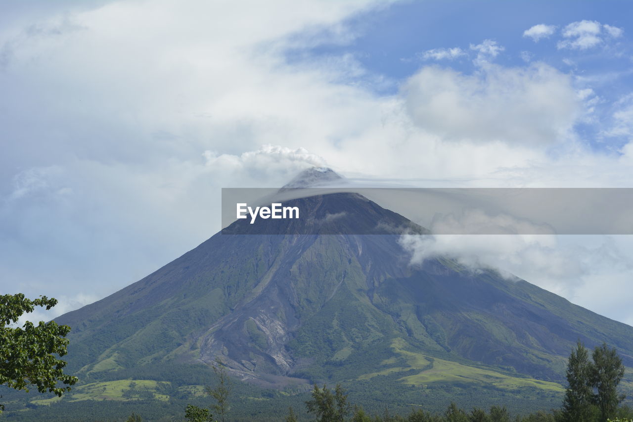 Scenic view of volcanic mountain against sky