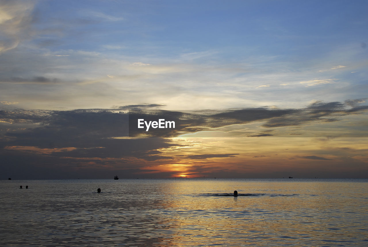 View of calm sea at sunset