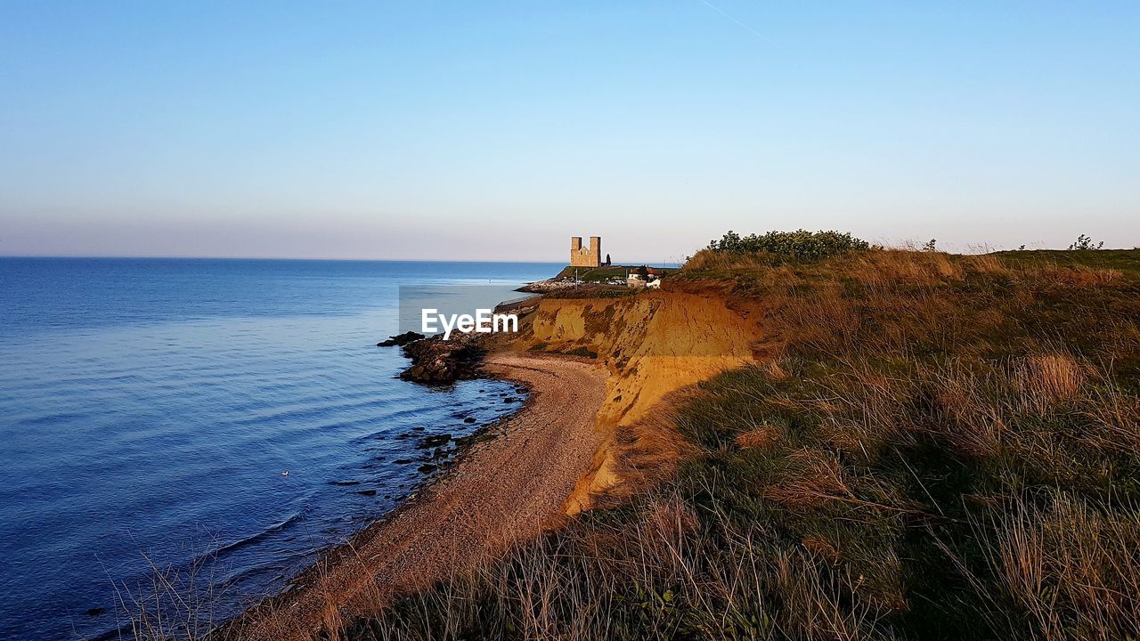 Scenic view of sea against clear sky