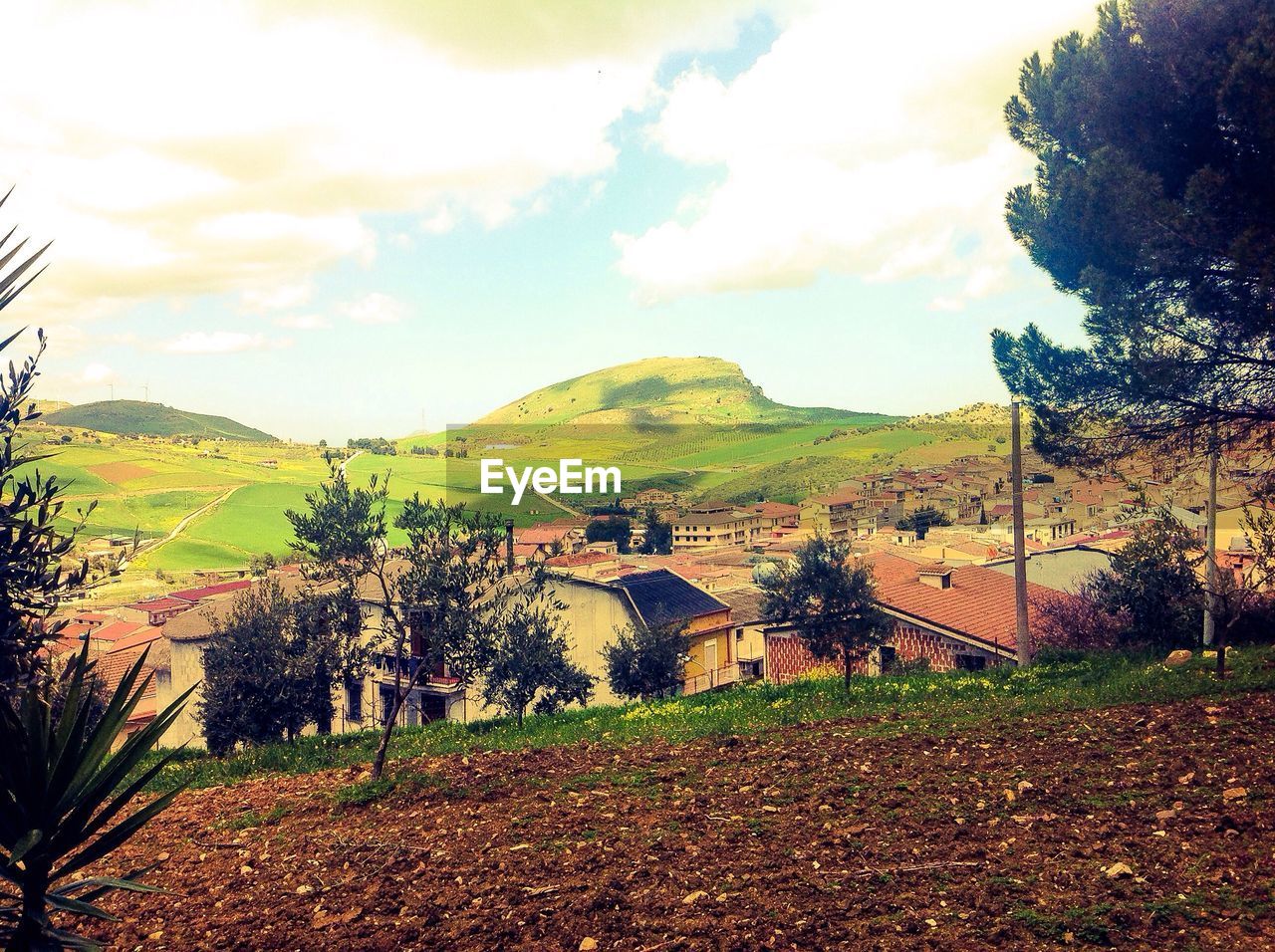 SCENIC VIEW OF MOUNTAINS AGAINST CLOUDY SKY