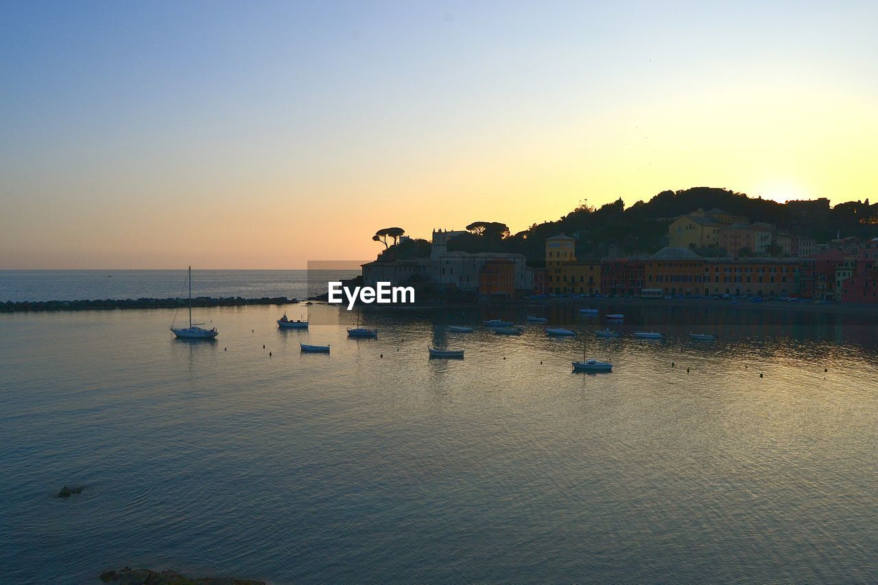 Scenic view of sea against clear sky during sunset